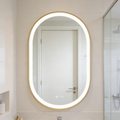 Ellie 22" x 32" pill front lit LED mirror with Brushed Gold frame